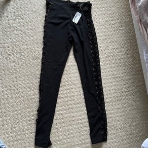Women laced up black pants